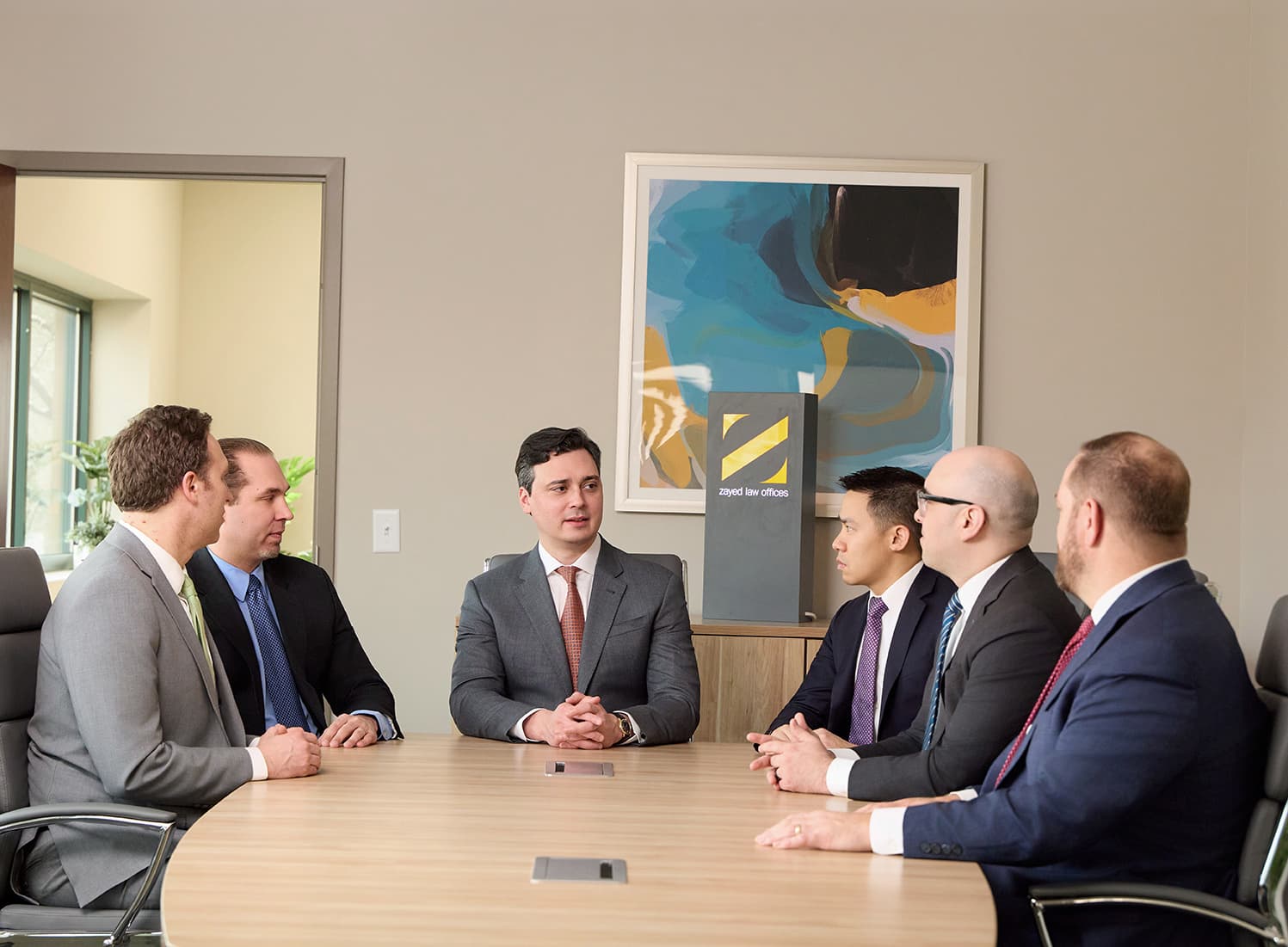 Zayed Law Offices attorneys meeting in the firm’s conference room